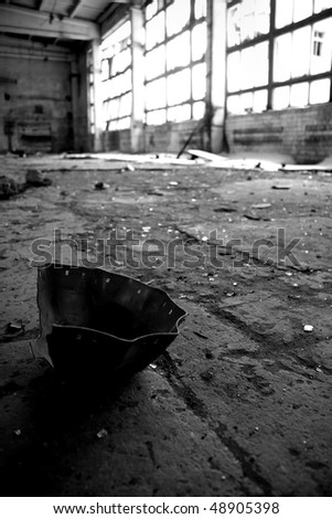 Abandoned Industrial interior with black object