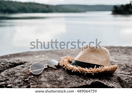 Hat with glass on nature .concept travel ,hipster tone and selective focus