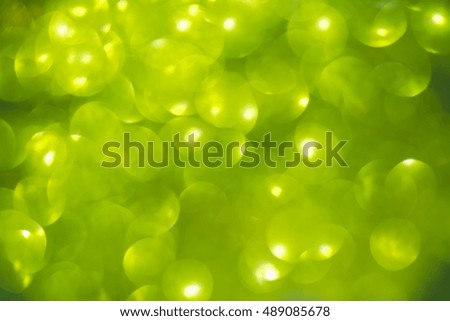Shimmering blur spot light on green color background, Christmas concept