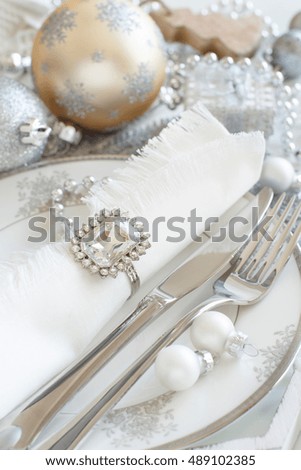 Silver and cream Christmas Table Setting with christmas decorations