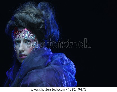 Portrait of young woman with creative visage, halloween picture.