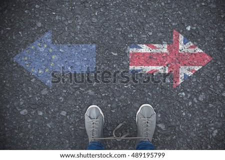 Low section of man with shoelaces tied together against close-up of european flag
