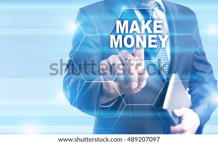Businessman is pressing on the virtual screen and selecting "Make money".