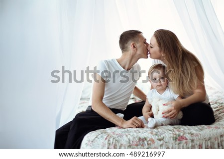 Happy beautiful family with a baby