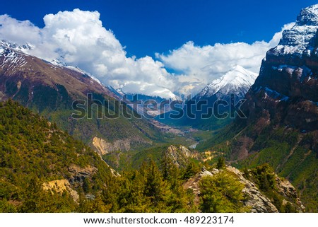 Landscape Snow Mountains Nature Viewpoint.Mountain Trekking Landscapes Background. Nobody photo.Asia Travel Horizontal picture. Sunlights White Clouds Blue Sky. Himalayas Hills