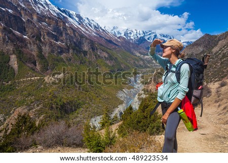 Closeup Beautiful Woman Traveler Backpacker Mountains Path.Young Girl Looks Horizon Take Rest.North Summer Snow Landscape Background. Horizontal Photo
