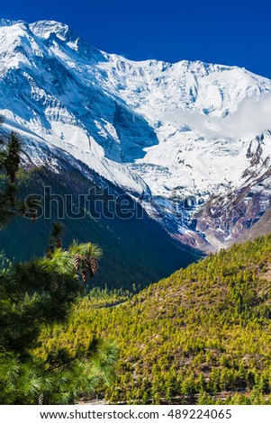 Landscapes Snow Mountains Nature Morning Viewpoint.Mountain Trekking Landscape Background. Nobody photo.Asia Vertial picture. Sunlights White Blue Sky. Himalayas Rocks