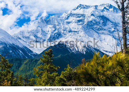 Landscapes Snow Mountains Nature Morning Viewpoint.Mountain Trekking Landscape Background. Nobody photo.Asia Horizontal picture. Sunlights White Clouds Blue Sky. Himalayas Rocks