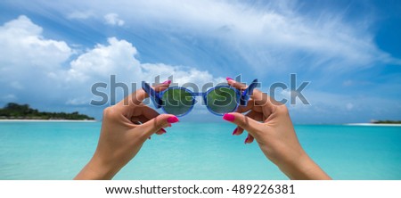 Picture of sunglasses on the tropical beach, vacation. Travel dreams concept, panorama format