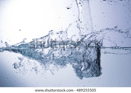 Bursts, splashing water droplets on a solid background, abstraction, studio lighting