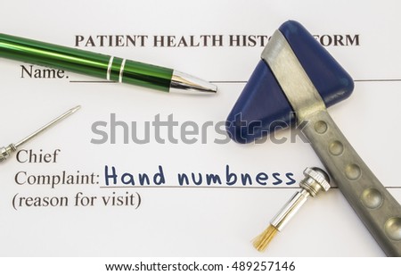 Complaint hand numbness. Patient health history is on table of neurologist, which contains complaint hand numbness surrounded by neurological hammer, brush and needle to determine sensitivity of skin