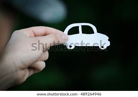 Paper car in hand 