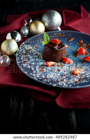 Christmas pudding chocolate cake with strawberry mint caramel sauce sugar chewy soft crispy dessert on menu festive 