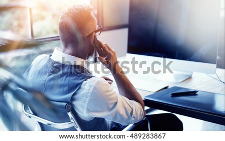 Closeup Bearded Businessman Wearing White Shirt Waistcoat Working Modern Loft Startup Computer.Creative Young Man Using Mobile Phone Call Business Meeting.Person Work Digital Tablet Desktop Table Royalty-Free Stock Photo #489283867