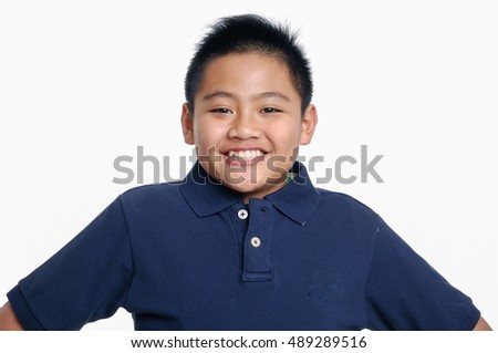 Portrait of young happy teen boy looking at camera.