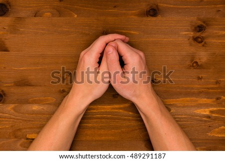 hands on the wooden background