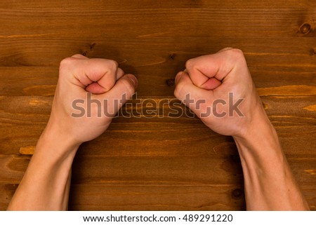 hands on the wooden background
