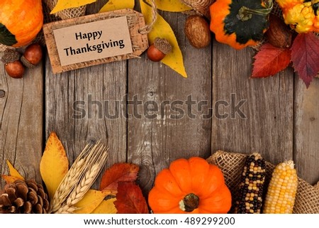 Happy Thanksgiving gift tag with double border of colorful leaves and pumpkins over a rustic wood background