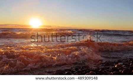 Nature. Red sunset colorful wave.