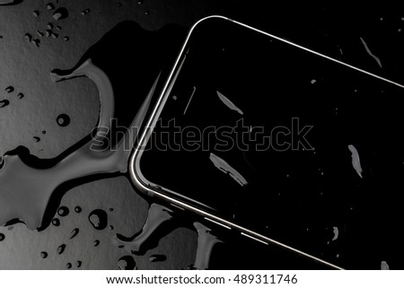 Waterproof smartphone with splashing of water on black  background