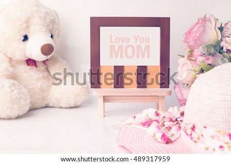 Classic wood photo frame on white background, photo frame with love you mom wording.