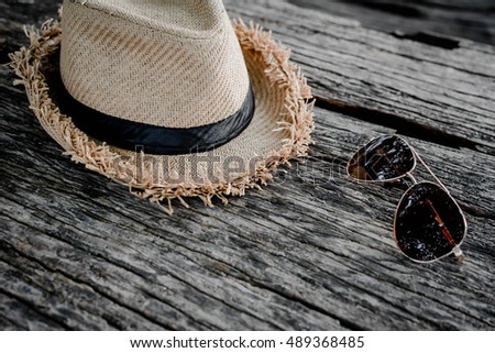 Hat and sunglass concept travel and hipster tone