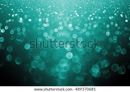 Elegant dark teal turquoise aqua black and green mint color glitter sparkle background or party invitation for holiday wedding celebration or Christmas Royalty-Free Stock Photo #489370681