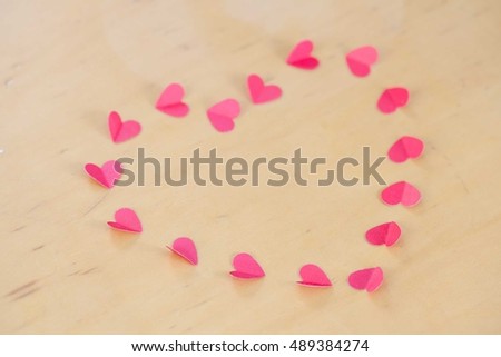Rad paper hearts arranged in a heart shape.