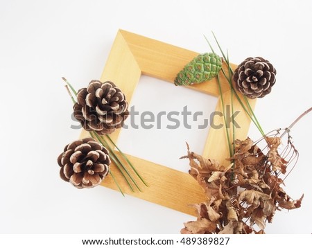 Empty frame decorated with material of autumn on white background