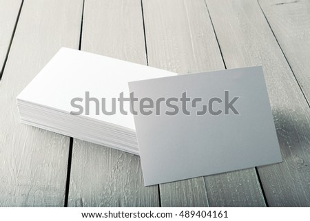 blank business cards on a wooden background