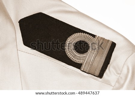 The shirt with navy rank arm decoration represent the navy uniform and military concept related background idea.