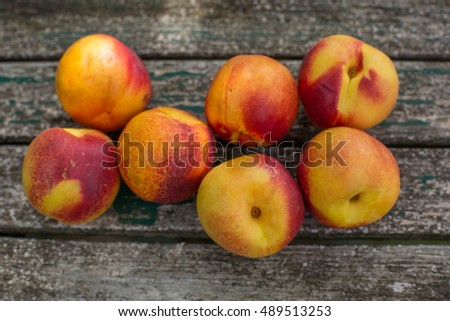 peach on a wooden table, outdoor