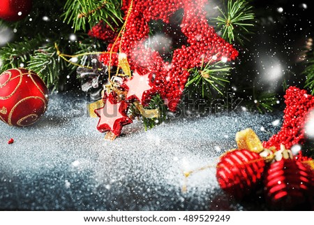 Christmas Composition with Red Toys Pine Cones Fir Tree on Dark Background