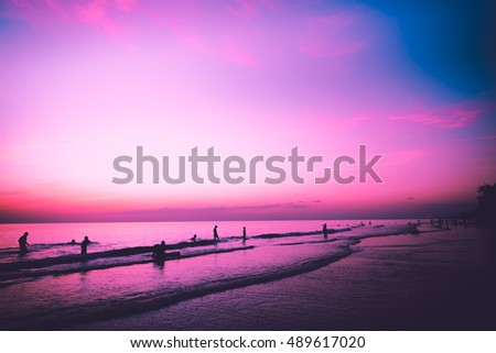 Nature in twilight period: Vintage tropical beach, sky and sea before the sunset for family vacation concept background - Vintage purple filter.