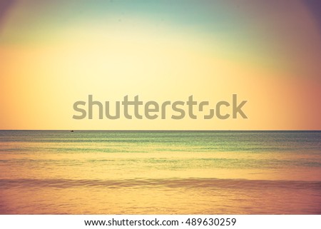 Sea sand sky and vintage summer day. Foot print on a summer sandy ocean beach. Lounge chair in the tropical beach. Close up sand with blurred sea sky vintage tone, summer day, copy space for product. 