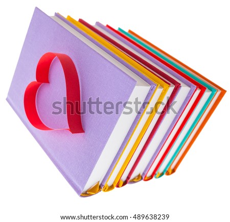 new books in colorful hard cover and paper tape in the shape of heart isolated on white background isolated on white background - pictures concept theme Love and St. Valentine's Day