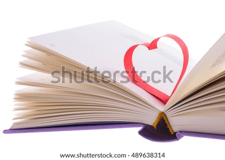 beautiful romantic red paper tape shape as heart, in a new small poetry book isolated on white background - pictures concept theme Love, St. Valentine's Day, or education