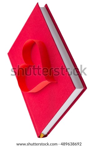 new book in red hard cover and paper tape in the shape of heart isolated on white background isolated on white background - pictures concept theme Love and St. Valentine's Day