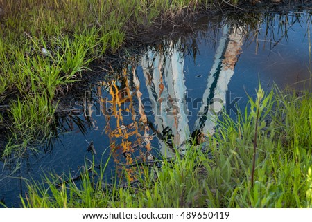 Reflection on oil of a drill in Termoli, south of Italy.
 Royalty-Free Stock Photo #489650419