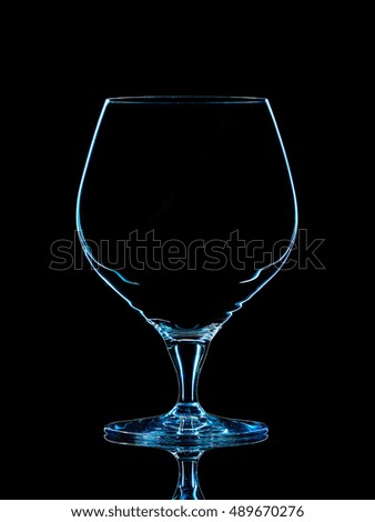 Silhouette of blue whiskey glass with clipping path on black background.