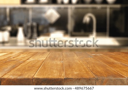 wooden table of free space and background of kitchen interior 