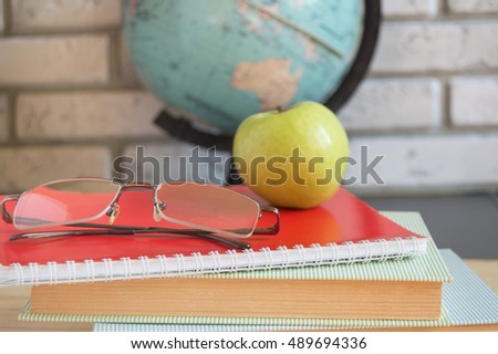 World teachers ' Day in school. Still life with books, globe, Apple, glasses selective focus