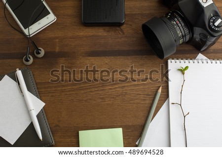 Top view of photographer's desk. Work desktop background with copy space