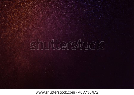 glitter vintage lights background. blue and purple. defocused