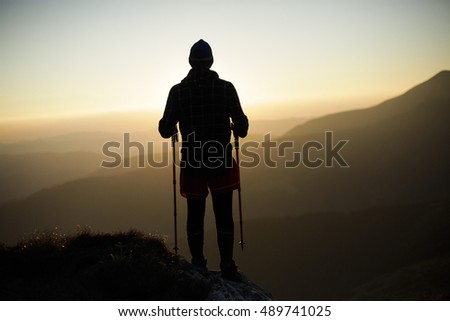 Silhouette of a climber on the high mountain. Sport and active life