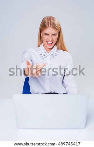Young businesswoman working at laptop computer.