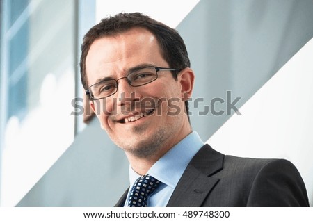 Portrait of male office worker wearing glasses