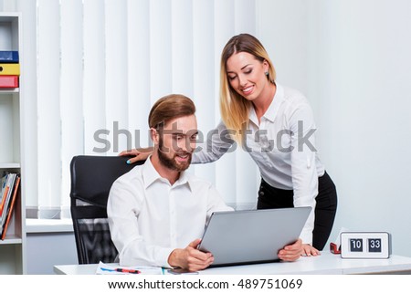 man and woman discussing a working project
