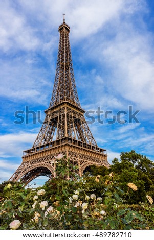 Wonderful view of Eiffel Tower (La Tour Eiffel). Eiffel Tower is tallest structure in Paris and most visited monument in world. Champ de Mars, Paris, France.