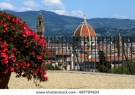 Beautiful View of Florence. Red Azalea in Bloom and Cathedral of Santa Maria del Fiore on Background in Florence, Italy.